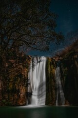 Vertical shot of Comala waterfalls at sunset in Chiquilistlan town, Jalisco, Mexico