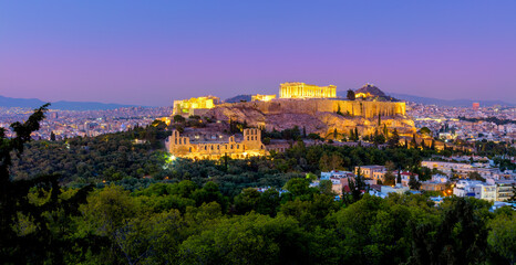 Greece - The Acropolis of Athens, Greece, with the Parthenon Temple with lights during sunset....
