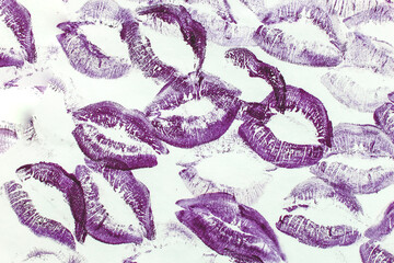 Lip prints of cosmetic lipstick on a light background.
