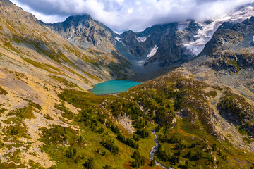 Fototapeta premium Summer Landscape beautiful mountains Altai with Poperechnoye Multinskoye green lake, Aerial top view