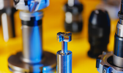 Set new drills and cutters for automatic metal processing CNC machine. Industrial tool equipment for iron factory