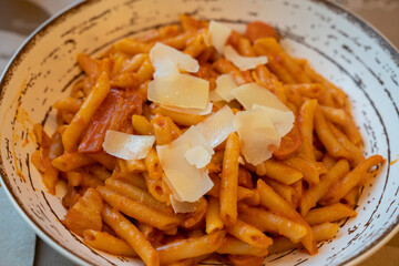 A plate of macaroni with tomato flavored beef sauce