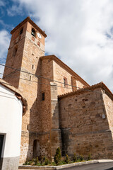 Fototapeta na wymiar El Castellar stone village in Gudar mountains Teruel Aragon Spain on March 11, 2023 The parish church.