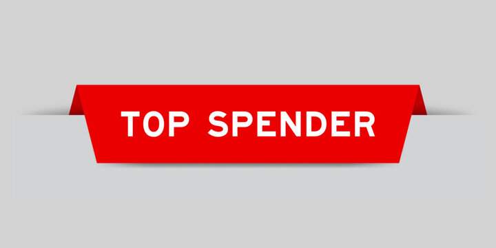 Red color inserted label with word top spender on gray background