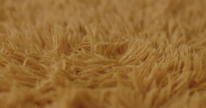 Short dense blanket pile on the front side of the fabric. Synthetic fibers made from polyester and polypropylene is inexpensive fibrous materials. 