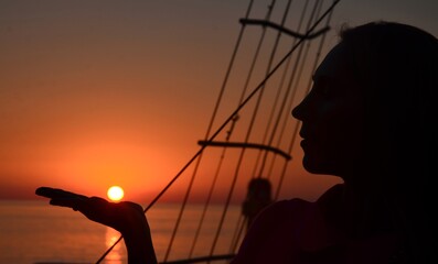 silhouette of a person on a yacht