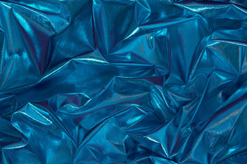 Abstract blue crumpled foil background. Minimal party concept.