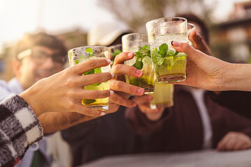 Friends Toasting Mojitos Outdoors