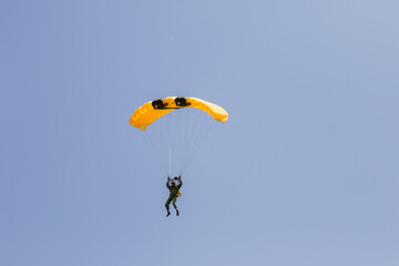 skydiver in the sky with a wing-type parachute