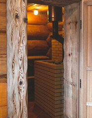 Traditional finnish sauna room wooden interior, cabin home wooden sauna spa cabin steam room with stone heater and wooden bench seats, relaxation and wellness in Scandinavia