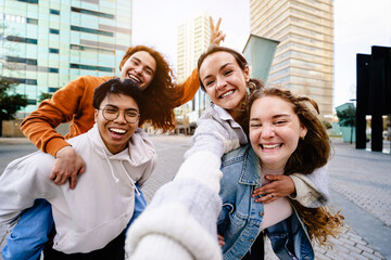 Teenager friends taking selfie portrait in the city - Happy generation z youngsters having fun...