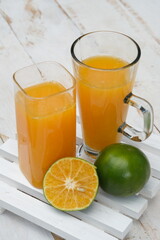watermelon and lemon juice. Watermelon is a tropical fruit with red flesh. source of vitamins A and C, contain lots of water and fiber. suitable for diet. served in a clear glass. Citrullus lanatus.