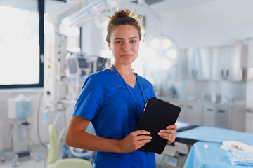 Portrait of young nurse in surgical department. - obrazy, fototapety, plakaty