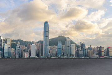cityscape and skyline of Hong Kong city at Victoria Harbour on view from empty concrete floor.