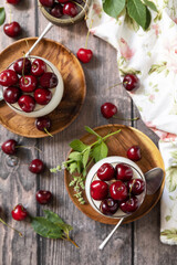 Panna cotta with sweet cherry jelly on a rustic table. Italian dessert, homemade cuisine. View from above.