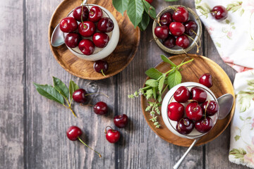 Panna cotta with sweet cherry jelly on a rustic table. Italian dessert, homemade cuisine. View from...
