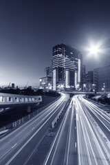 Fototapeta premium Modern office building and traffic in downtown district of Hong Kong city