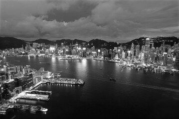 Aerial view of Victoria Harbor of Hong Kong city at dusk