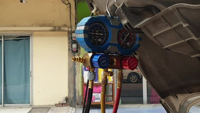 Repair garage checking for air AC compressor cooling system leaking suspect auto shop check pressure