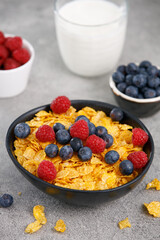 Close-up of blueberry and raspberry cereal on marble table