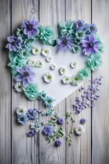 Heart-shaped Blue Blossoms on Light Wooden Background