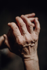 Close up of wrinkled hands, copy space.