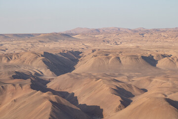 Fototapeta na wymiar sunrise in the desert with clouds and sand