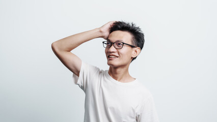 Young confident asian chinese young man checking hair style and dandruff.