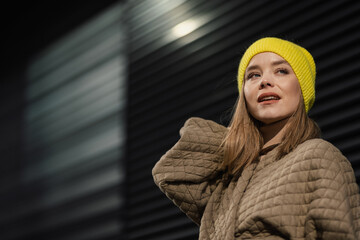 Portrait of young fashionable woman in a city.