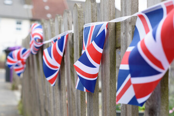 Union Jack flags hanging ready to national holiday celebration. Shallow DOF, selective focus