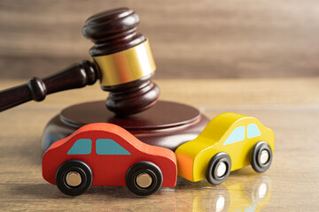 Hammer gavel judge with car vehicle accident, insurance coverage claim lawsuit court case. .