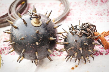 medieval weapon consisting of a heavy iron ball with spikes, which is attached to a strong chain