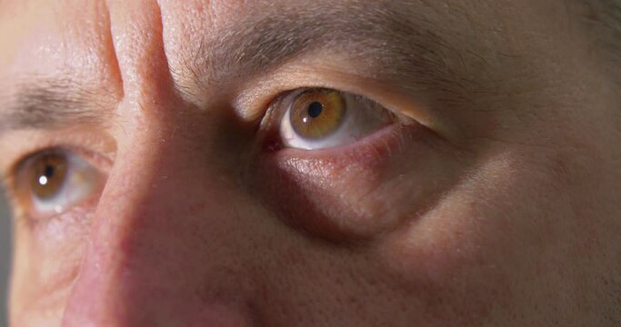 Man's Eyes Looking Up Into the Light with a Close Up.