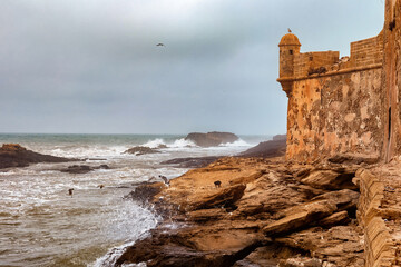 View of the ancient medieval walls on the Atlantic Ocean coast. Essaouira, Morocco.
