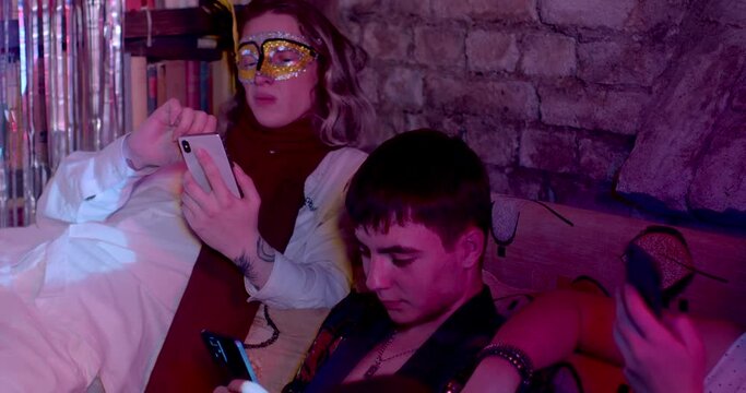 Friends are on their phones at party, find it easier to communicate with people online. Cellphones have affected speaking and listening communication.18.10.2022 Jaselska, Prague, CZ
