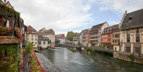 Fototapeta na wymiar River view with buildings of a region of the city of Strasbourg, France