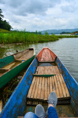 January 5, 2022. Photo of gray shoes on the edge of the lake, Wadaslintang, Indonesia