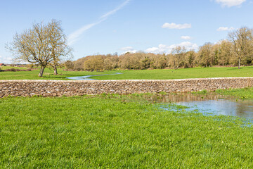 The Thames Path long distance walking trail beside the infant River Thames 400 metres from its...