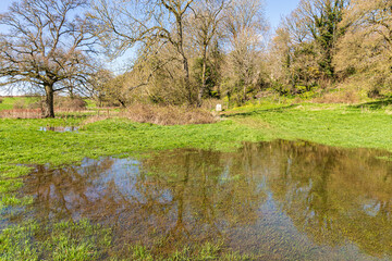 The Thames Path long distance walking trail at the source of the River Thames at Thames Head on the...