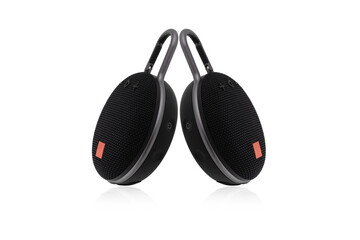 Wireless speaker on a white background. Round music speaker close-up.