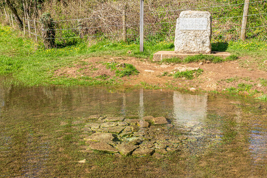 The stone marking the source of the River Thames at Thames Head on the Cotswolds near Kemble, Gloucestershire, England UK