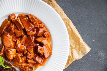 squid tomato sauce seafood salad meal aperitif food snack on the table copy space food background...