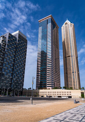 Fototapeta na wymiar New apartment blocks and hotel along the cycle path along Dubai Canal