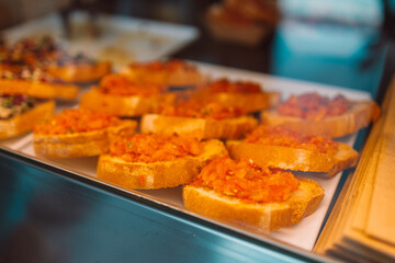 closeup shot of an bruschetta with tomato and basil at city cafe, Pisa, Italy