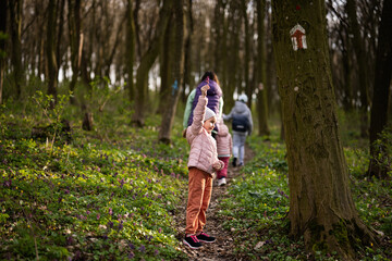 Girl on forest trail. Outdoor spring leisure concept.