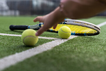 Close up of tennis rackets and tennis balls lying on tennis court. sport, tennis and activity.