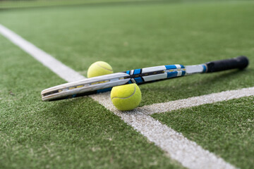 Close up of tennis rackets and tennis balls lying on tennis court. sport, tennis and activity.