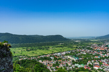 Fototapeta na wymiar Panoramic view of Khust city from Khust castle in Khust, Ukraine on June 24, 2021.