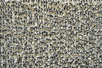 A surface of heavy duty scrub sponge with metallic fibers as background