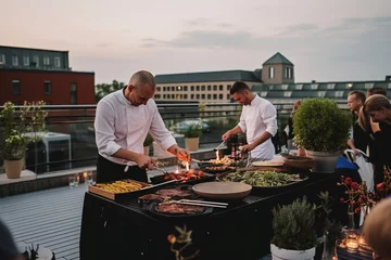 Gardinen Chef cooking at a live station at a corporate party on a terrace outside. Generative AI © Mihai Zaharia